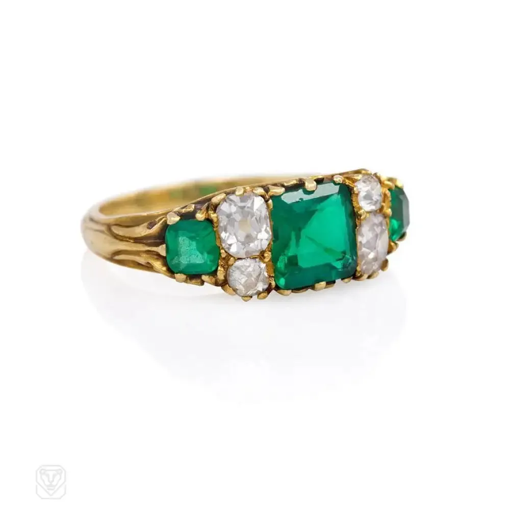 Antique gold ring set with emeralds and old mine diamonds